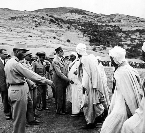 Charles de Gaulle, president of France, meets some Algerians in August 1959; photo credit.