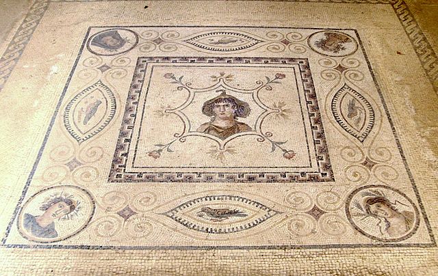 A 2nd-century CE mosaic of Goddess Africa with Four Seasons at the corner, in El Djem Museum Tunisia